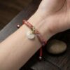 th-11134207-81ztn-mnfel6k2wqgzbc.jpg สร้อยข้อมือเชือกแดง ด้ายแดงมงคล + ด้าย 5 สี จี้หยกก้อนเมฆ เสริมโชคลาภ การเงิน ความสมดุล ฮวงจุ้ย ปรับขนาดได้ สายมู