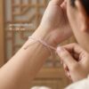 สร้อยข้อมือเชือกชมพู ด้ายชมพูมงคล + จี้ม้าเสริมด้านความรัก  ปรับขนาดได้ เสริมความรัก โชคลาภ เครื่องประดับสายมู